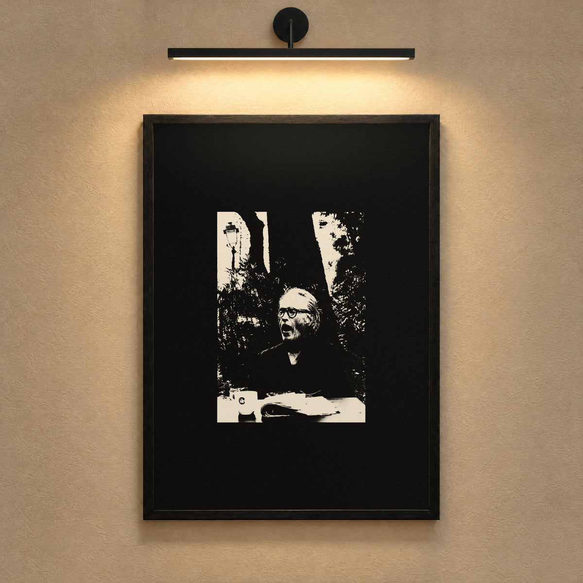 Always Tired by Lohause, framed black and white print under a gallery picture light