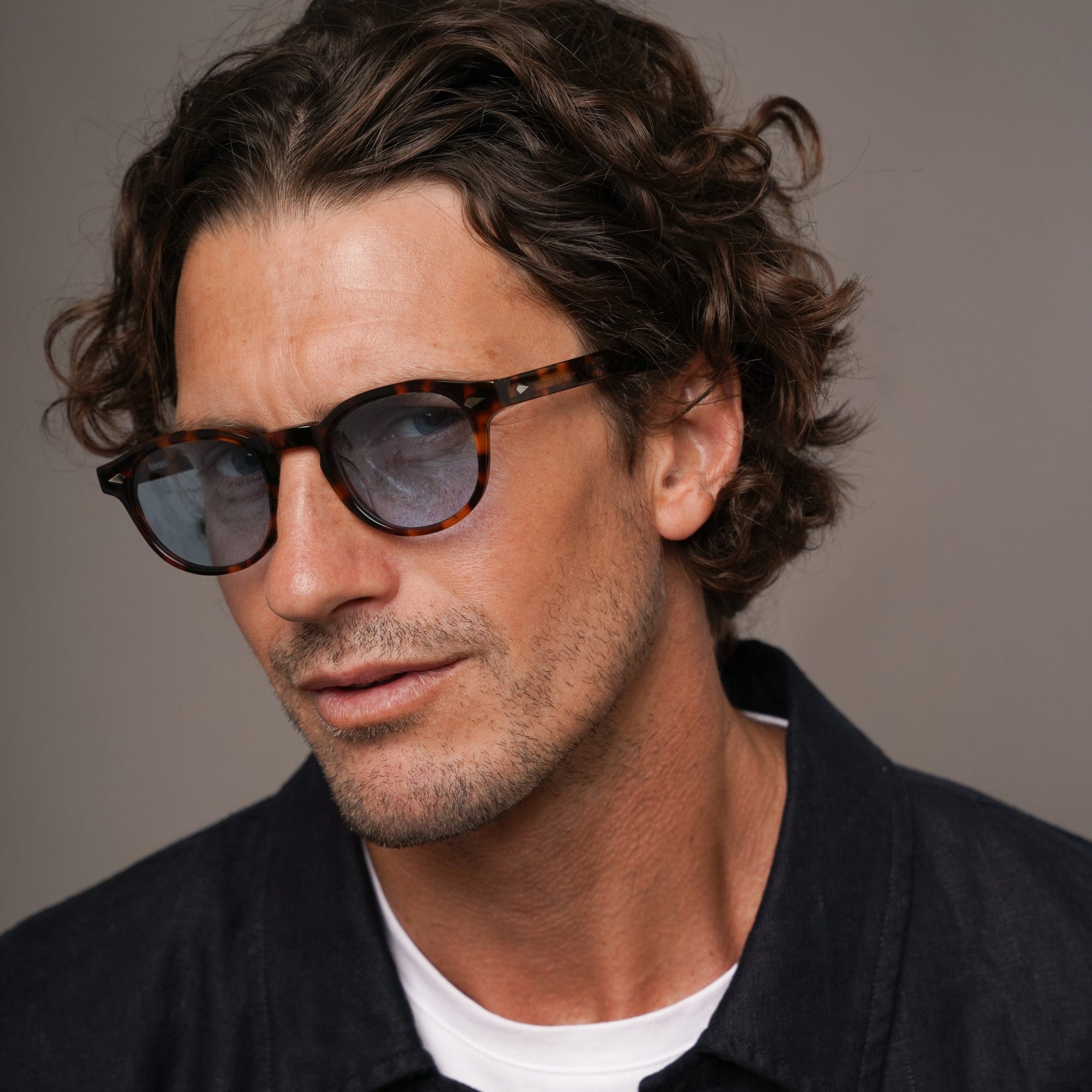 The Basquiat Bon Vivant, Mazzucchelli 1849 acetate frame, rounded square shape, tortoise with blue-tinted lenses.