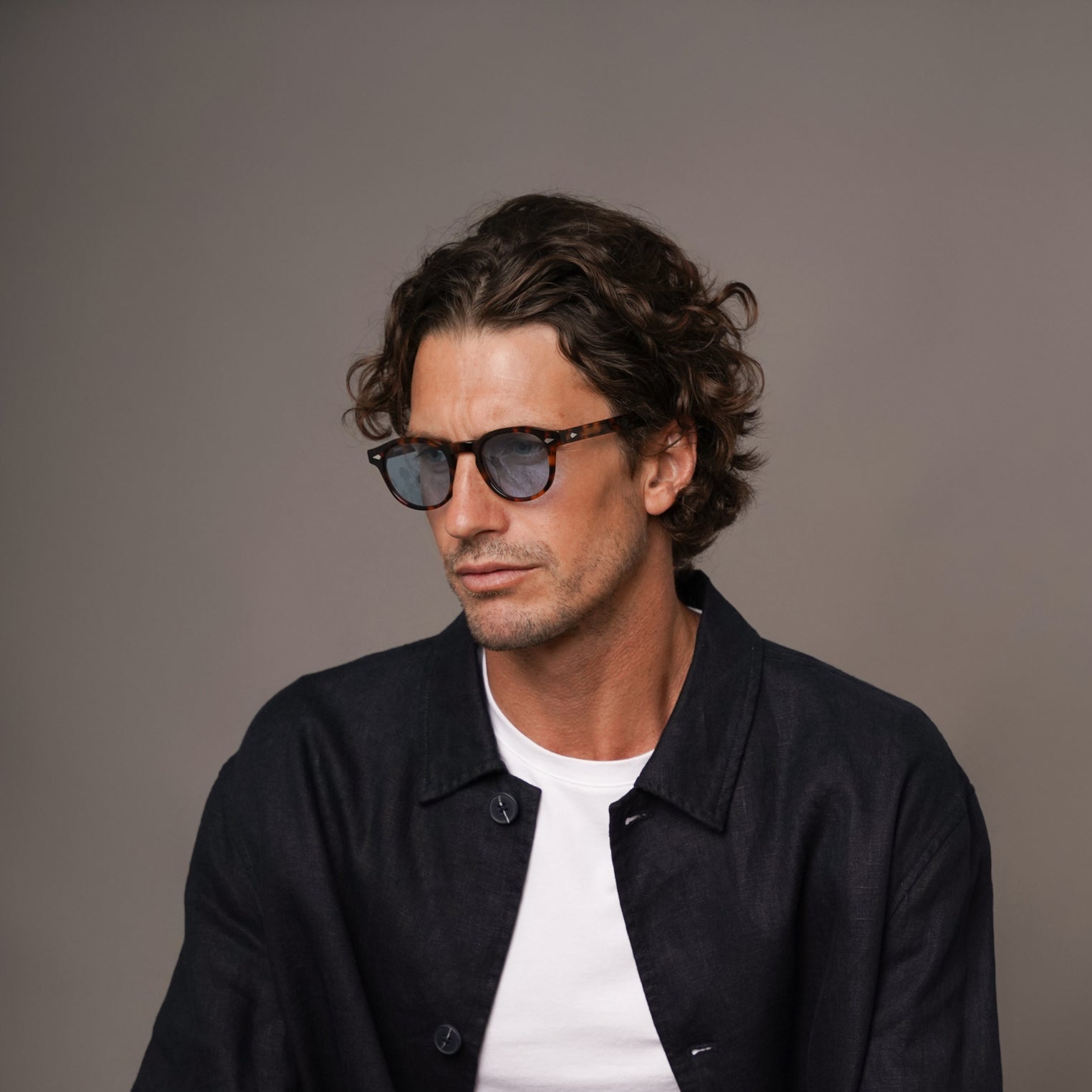 The Basquiat Bon Vivant, Mazzucchelli 1849 acetate frame, rounded square shape, tortoise with blue-tinted lenses.