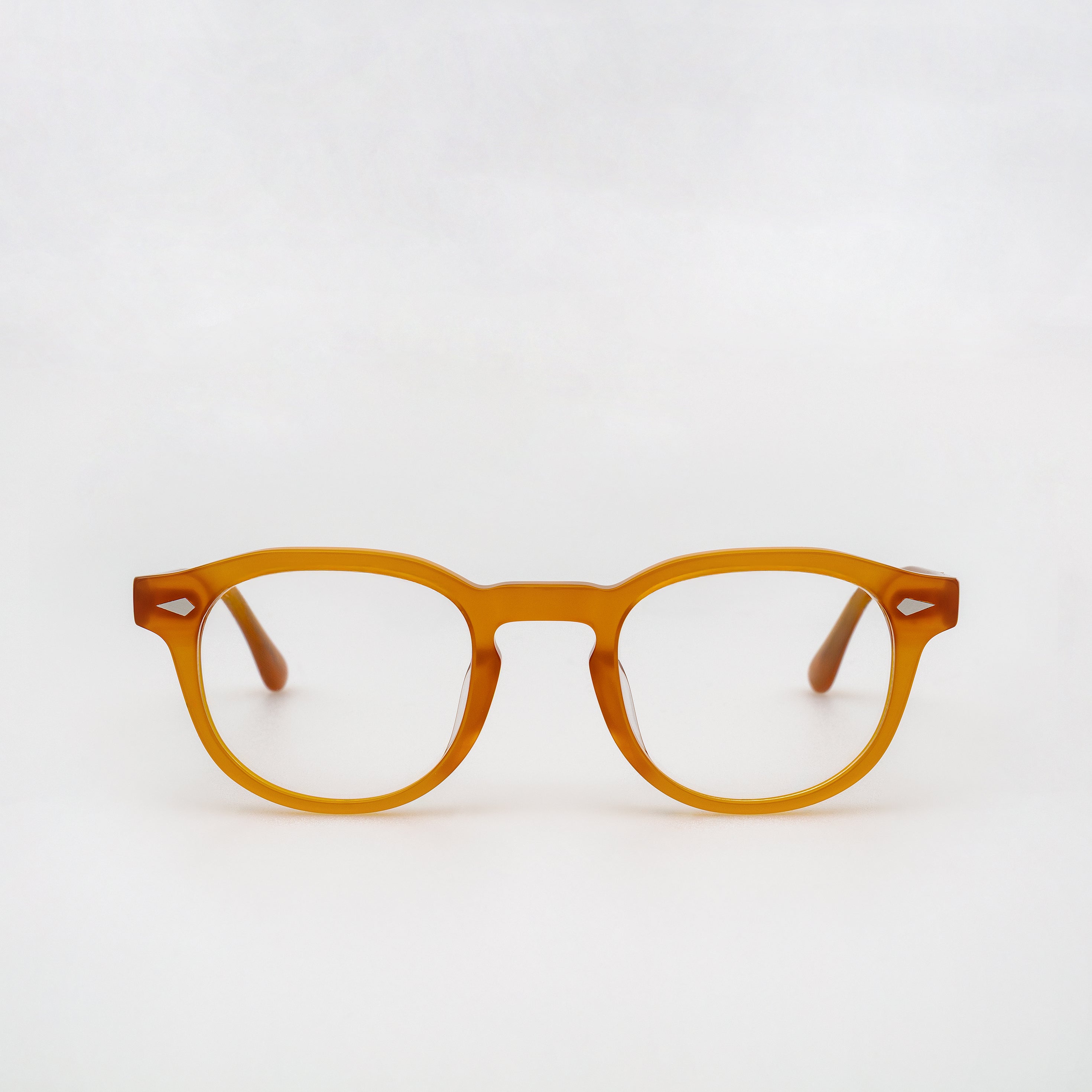 The Basquiat Amber — eyeglasses, Mazzucchelli 1849 acetate frame, rounded square shape, in amber.