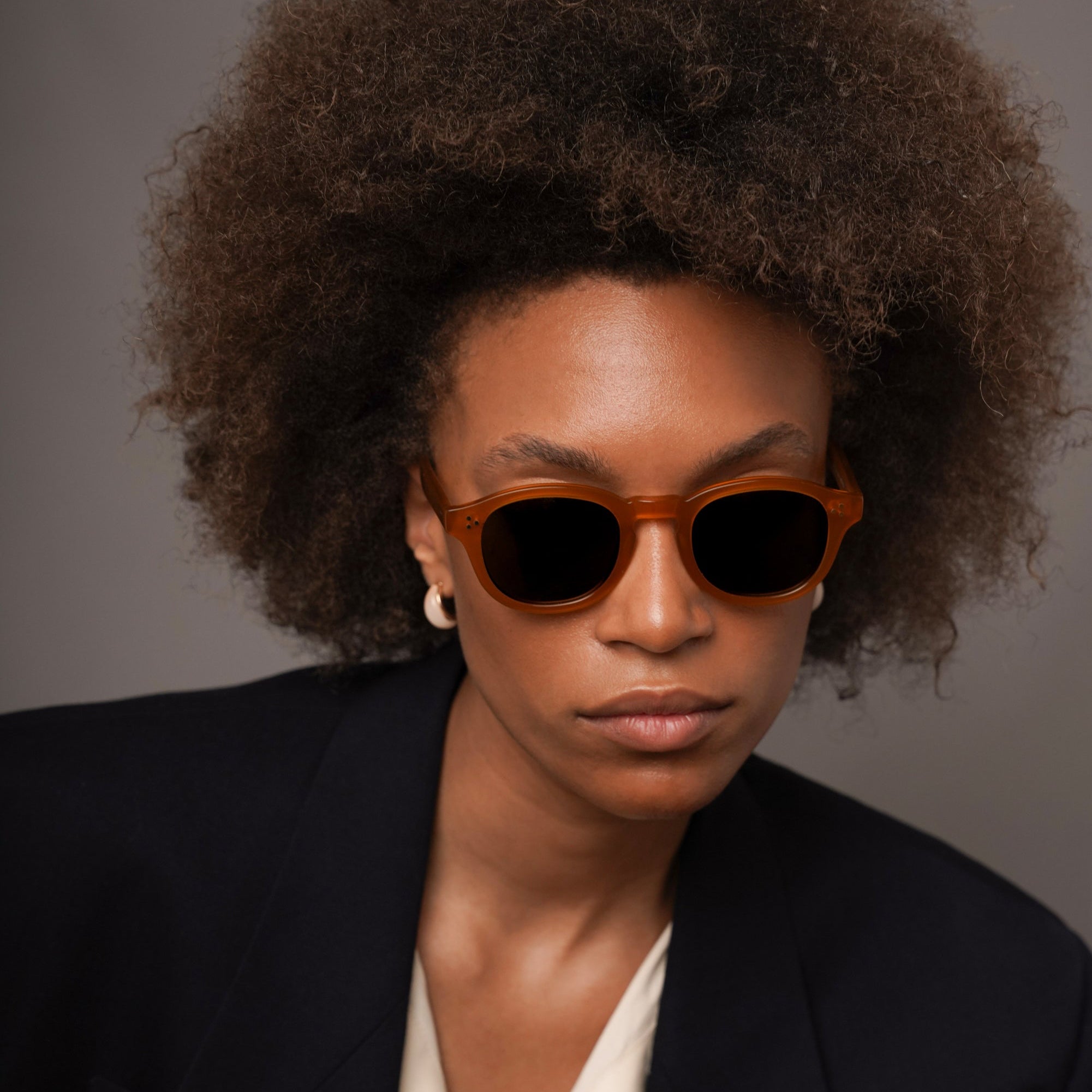 The Evans Amber Sunglasses, Mazzucchelli 1849 acetate frame, round shape, in amber.
