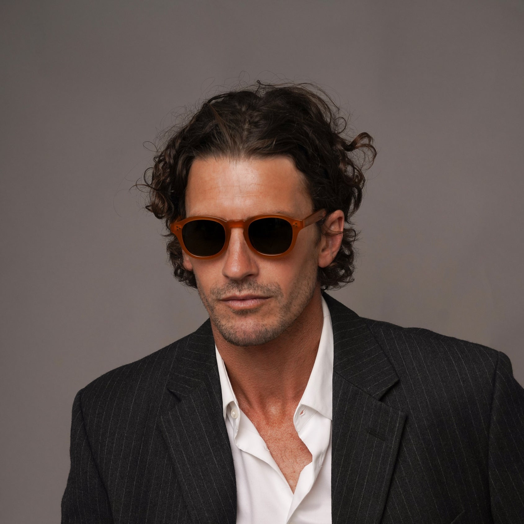 The Evans Amber Sunglasses, Mazzucchelli 1849 acetate frame, round shape, in amber.