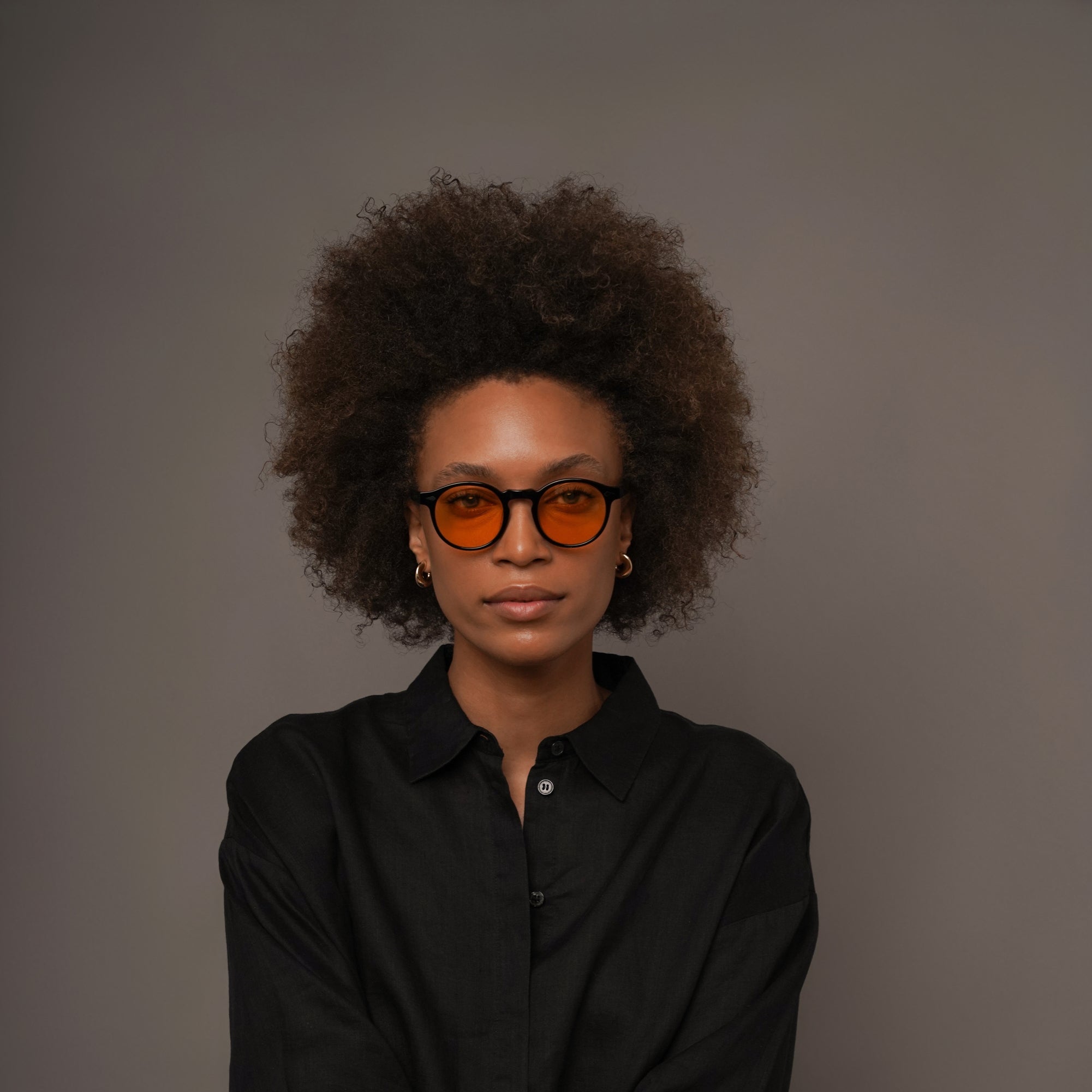 The Picasso La Vie en Fauve, Mazzucchelli 1849 acetate frame, round shape, black with orange-tinted lenses.