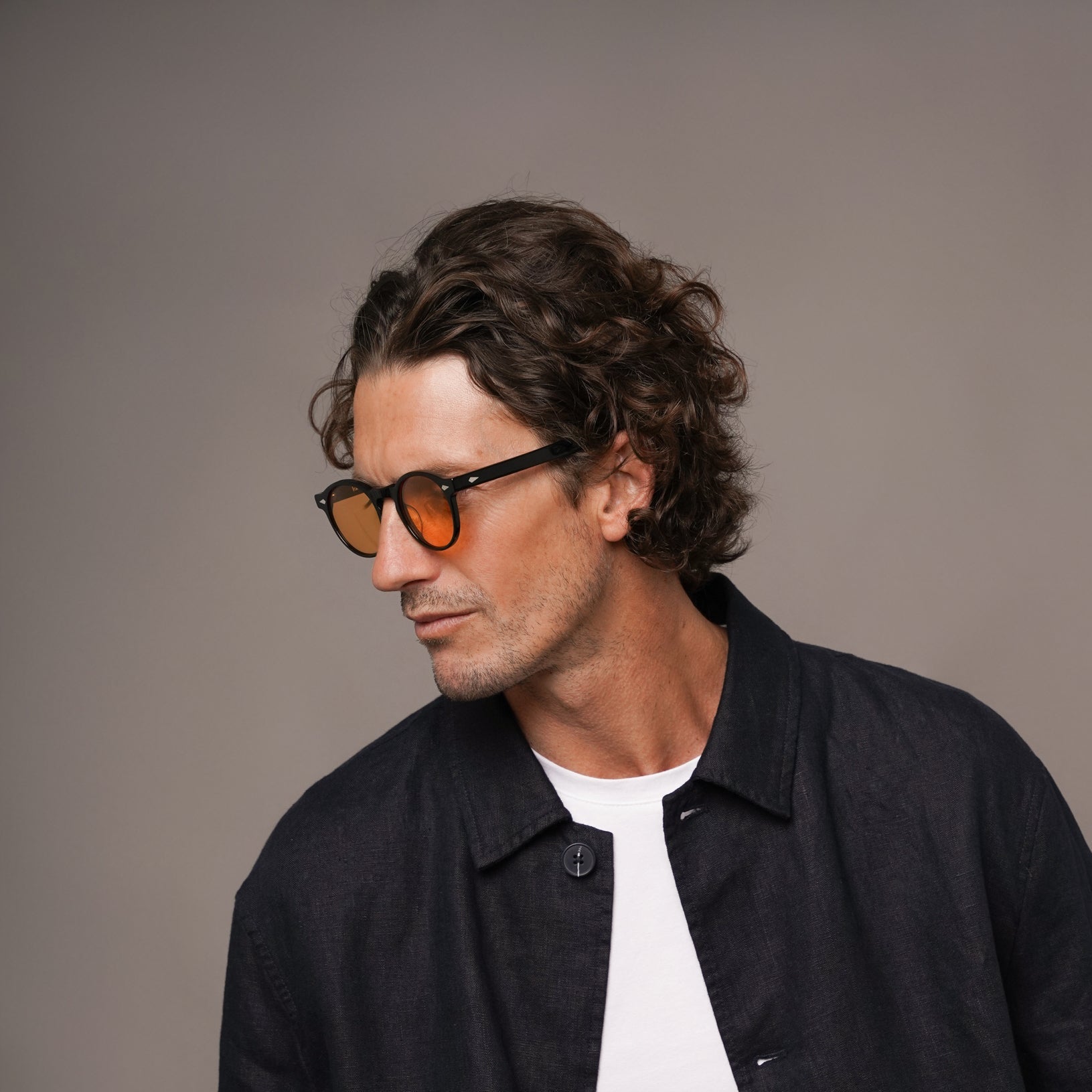 The Picasso La Vie en Fauve, Mazzucchelli 1849 acetate frame, round shape, black with orange-tinted lenses.