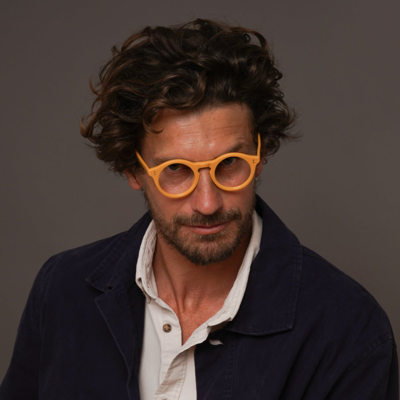 The Spike Amberfort — eyeglasses, Mazzucchelli 1849 acetate frame, round shape, in deep amber.