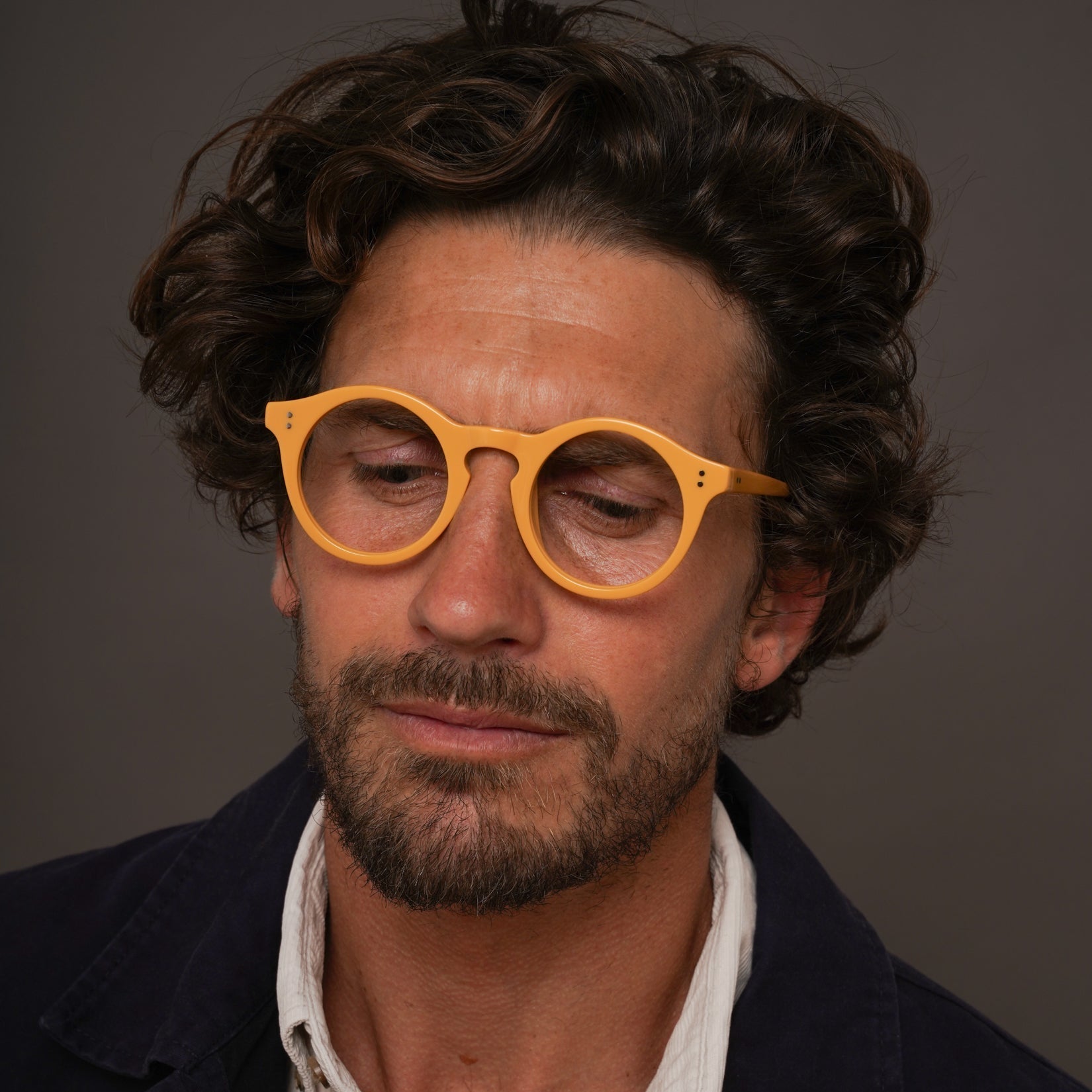 The Spike Amberfort — eyeglasses, Mazzucchelli 1849 acetate frame, round shape, in deep amber.