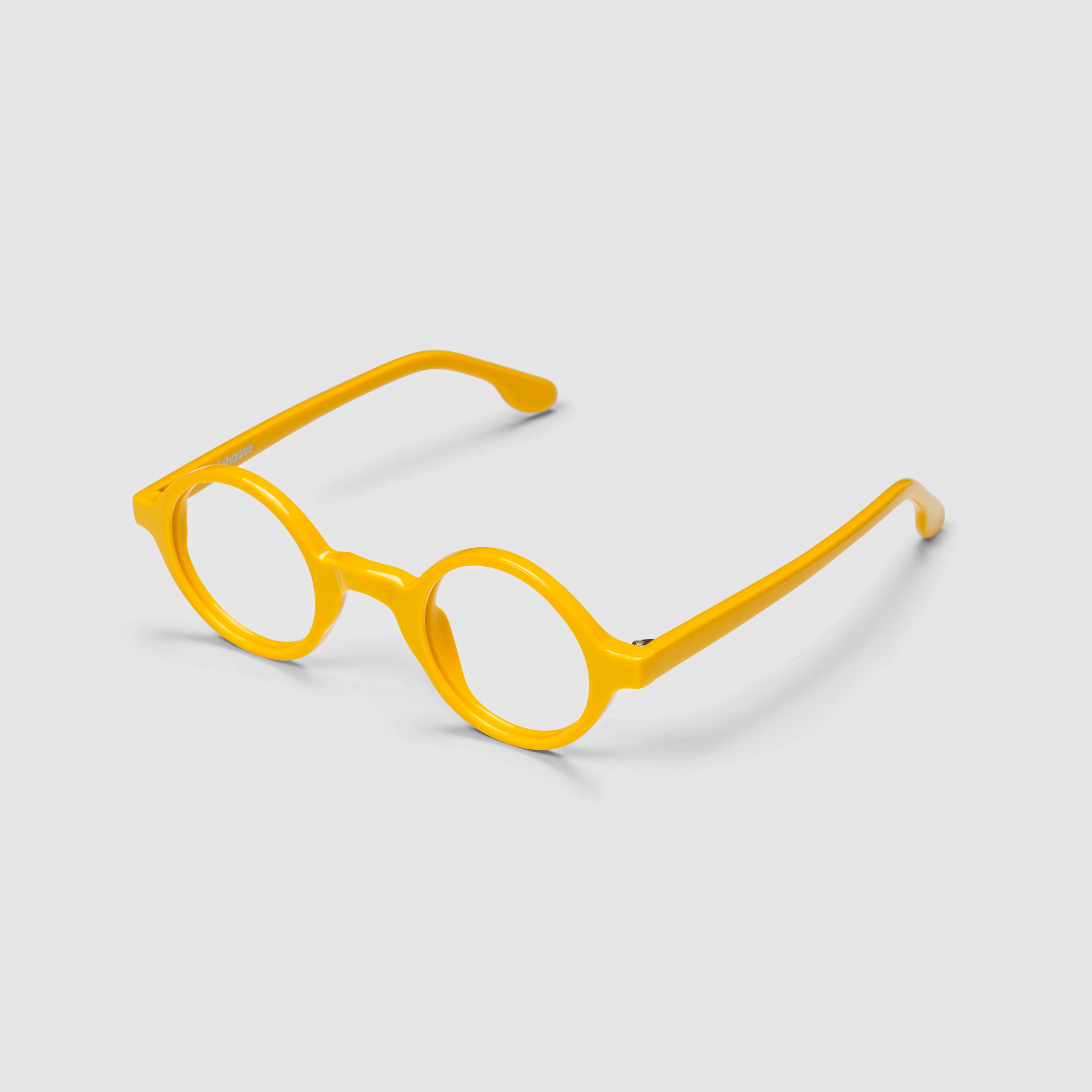 The Winston Amberfort — eyeglasses, Mazzucchelli 1849 acetate frame, round shape, in deep amber.