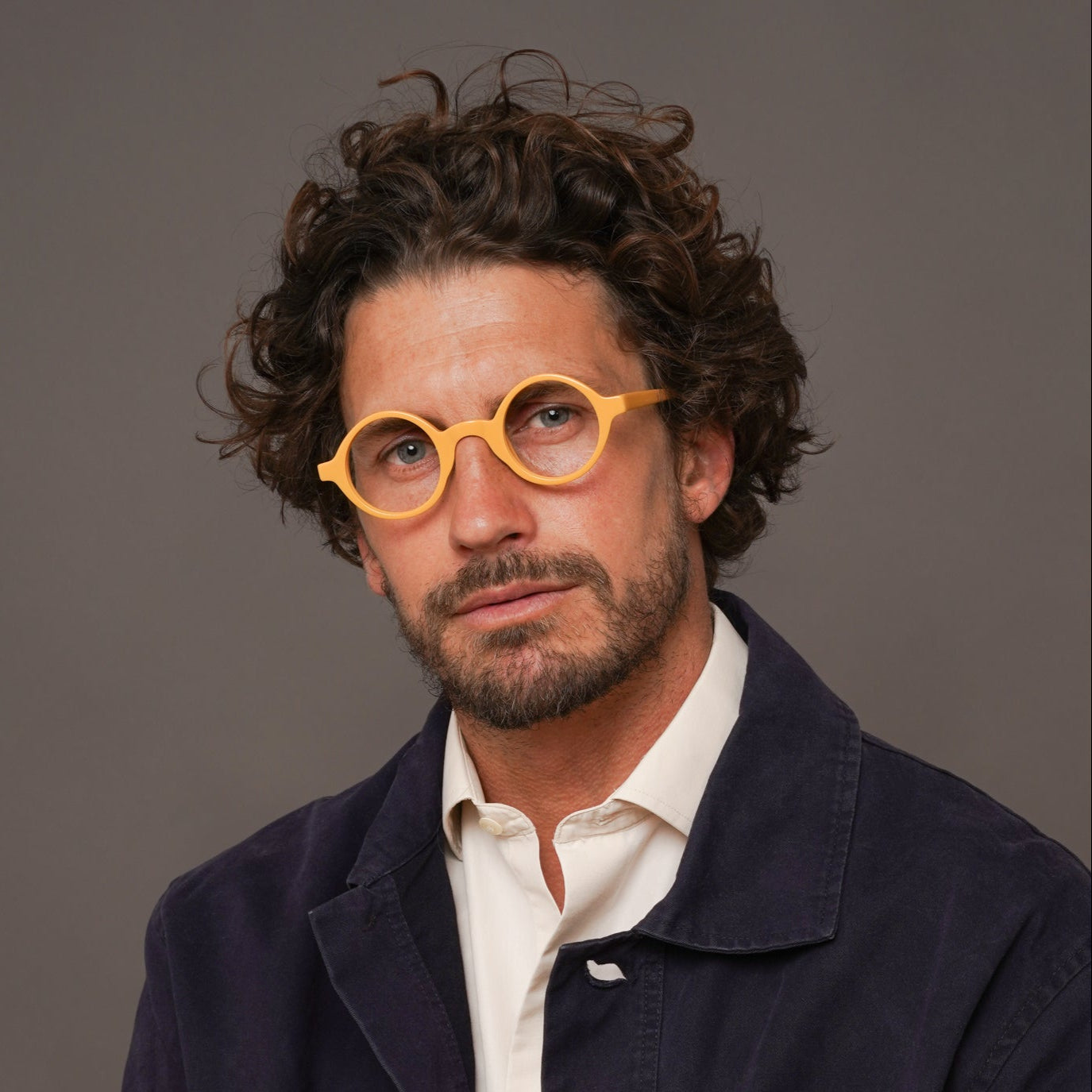 The Winston Amberfort — eyeglasses, Mazzucchelli 1849 acetate frame, round shape, in deep amber.