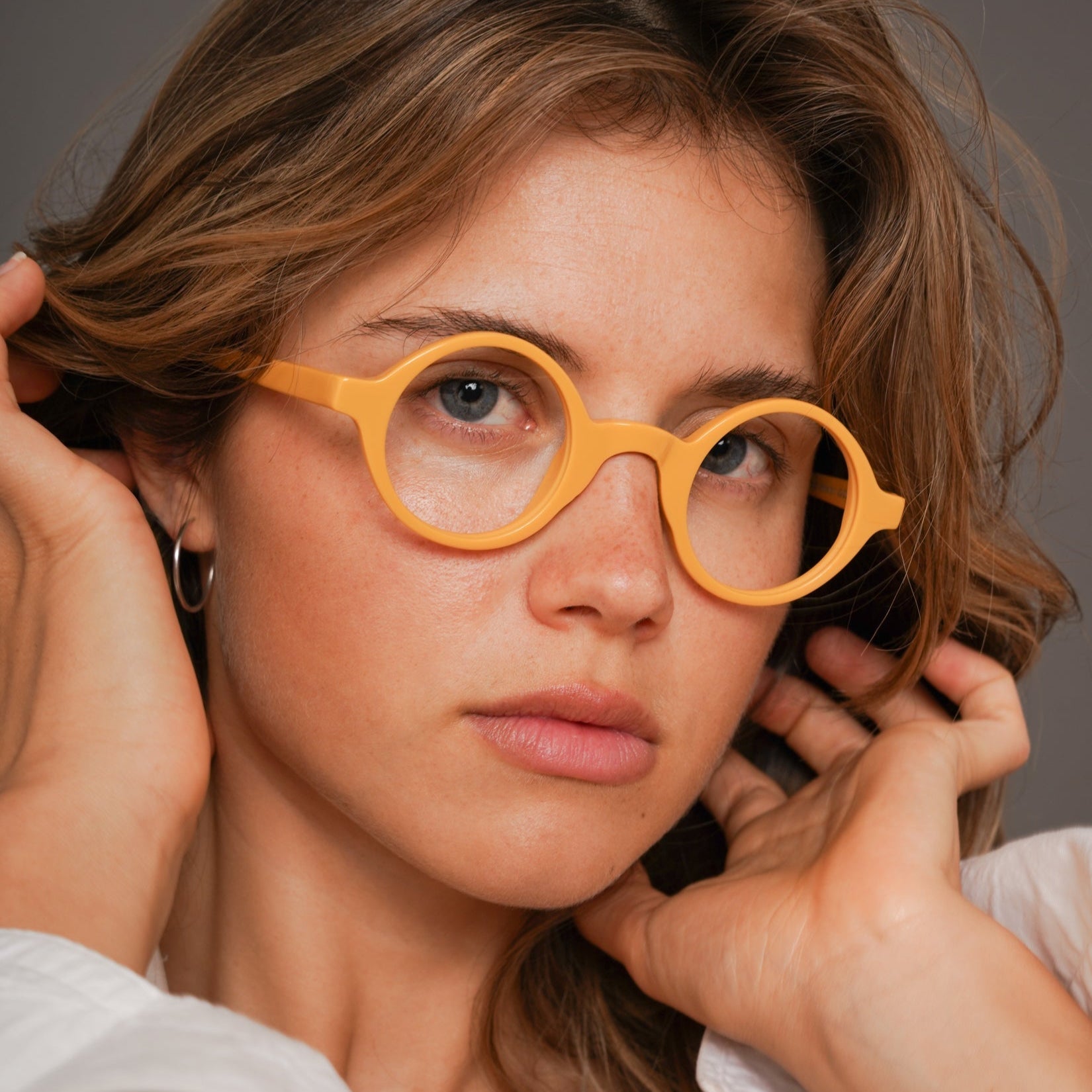 The Winston Amberfort — eyeglasses, Mazzucchelli 1849 acetate frame, round shape, in deep amber.
