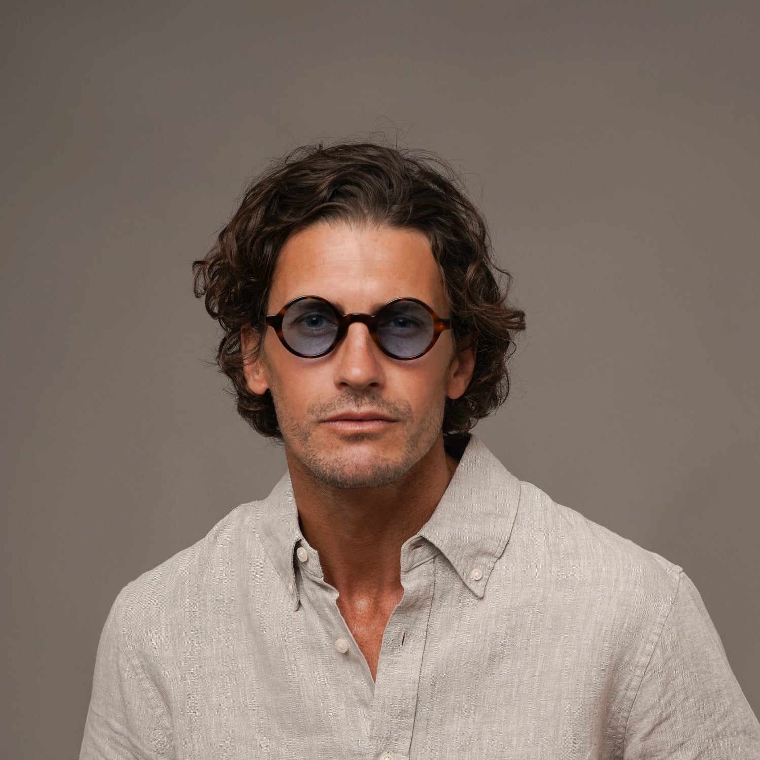 The Winston Bon Vivant, Mazzucchelli 1849 acetate frame, round shape, tortoise with blue-tinted lenses.