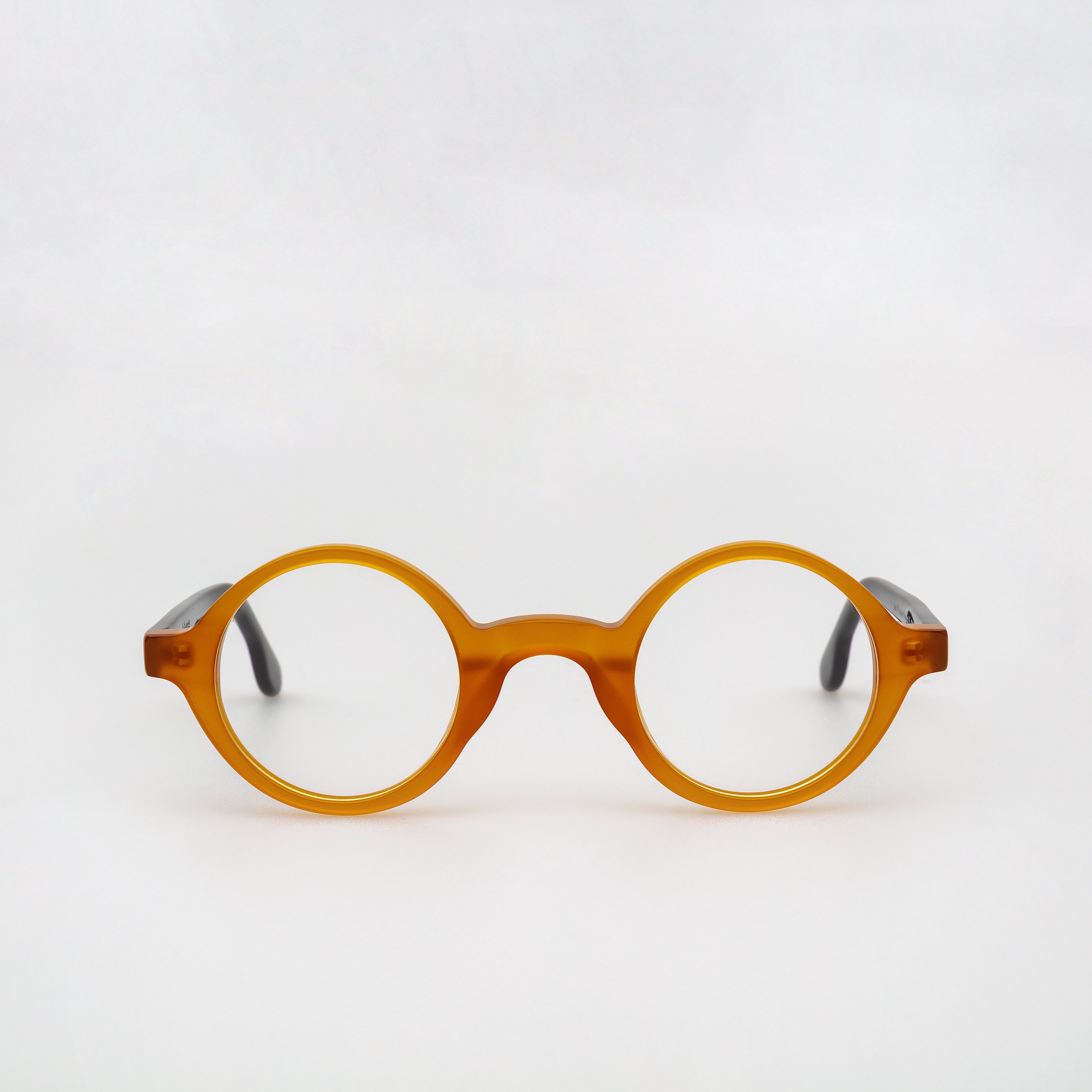 Round eyeglasses with a tortoiseshell frame on a white background