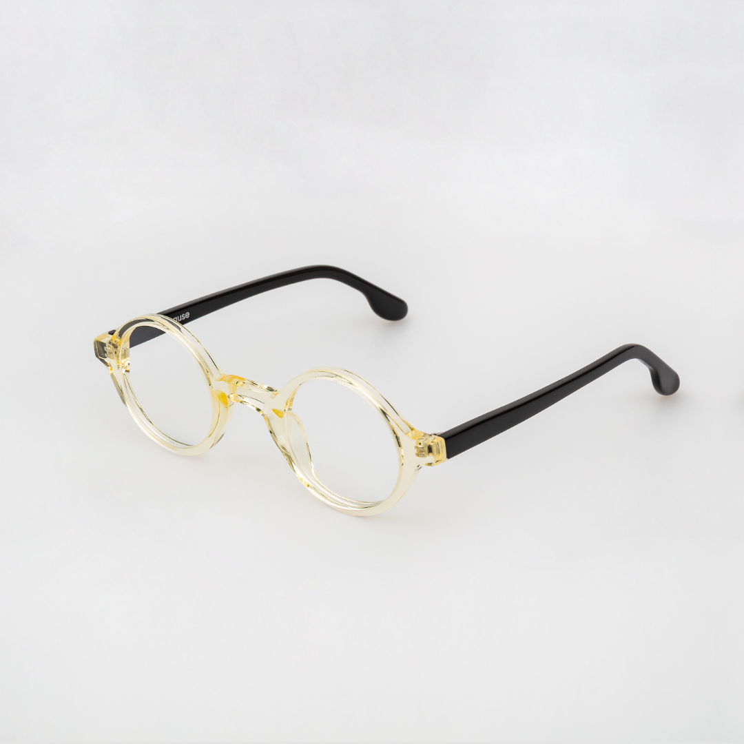 Round eyeglasses with black and transparent  frame on a light gray background